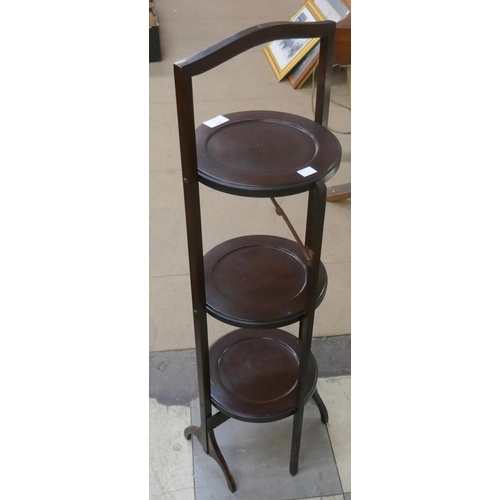 302 - A mahogany three tier folding cake stand