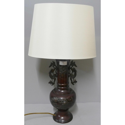 308 - A Chinese bronze table lamp