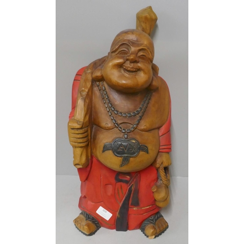 309 - A painted carved wood Buddha