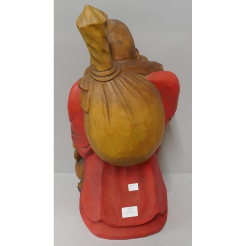 309 - A painted carved wood Buddha