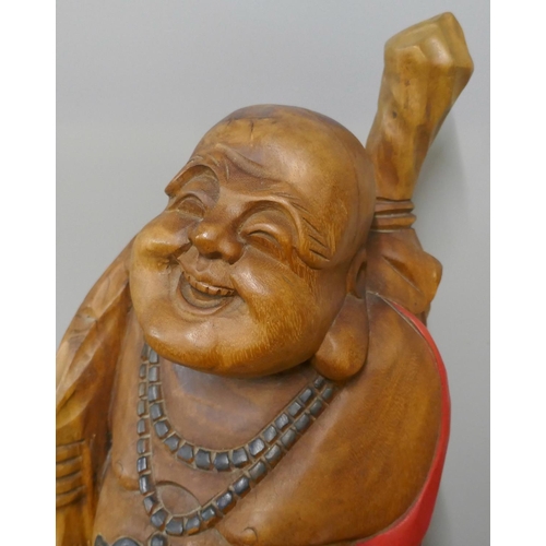 309 - A painted carved wood Buddha