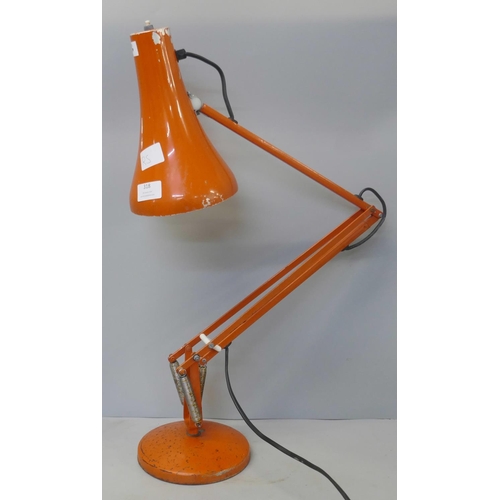 318 - A red metal anglepoise desk lamp