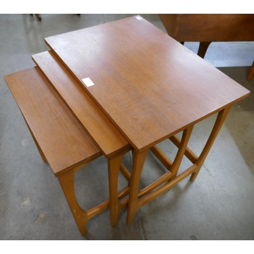 32 - A teak nest of tables