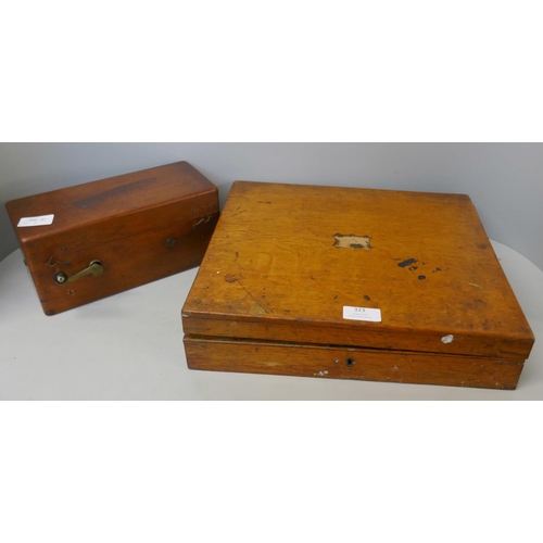 323 - A wooden case of plated cutlery and an electric shock machine