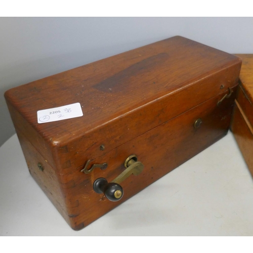 323 - A wooden case of plated cutlery and an electric shock machine