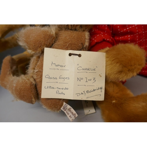 332 - Four Teddy bears; two Bainbridge bears, a Ferrari Scuda bear and a Cricketer Canterbury bear