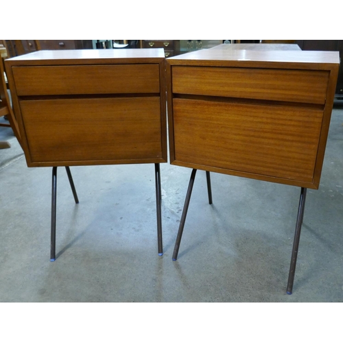 35 - A pair of teak bedside chests on black tubular metal legs