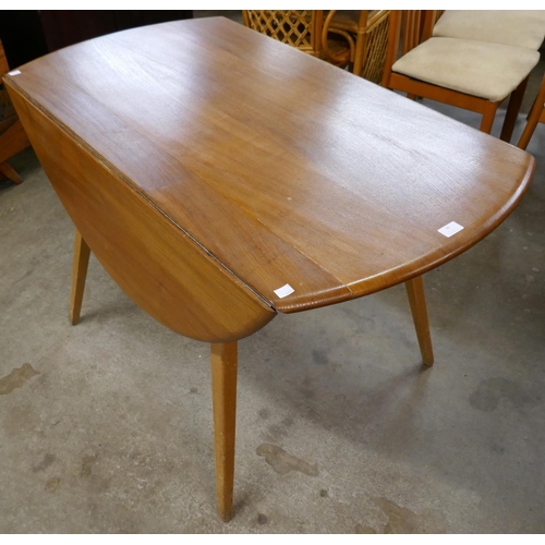 36 - An Ercol elm and beech Windsor drop-leaf dining table