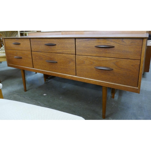 38 - A teak six drawer sideboard