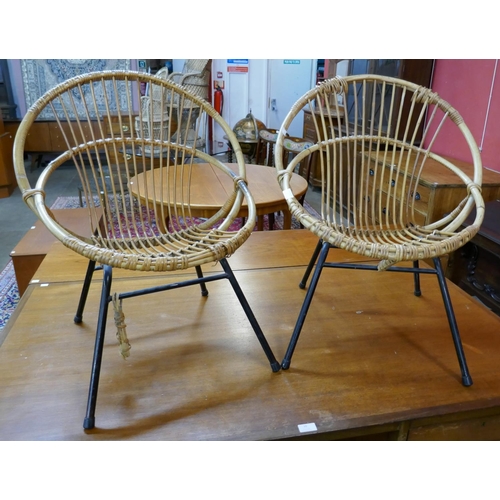 42 - A pair of bamboo and black tubular steel ball chairs