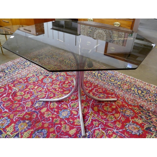 44 - A chrome and hexagonal glass topped dining table