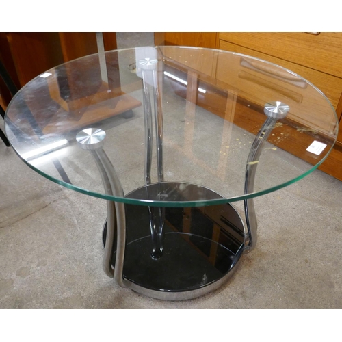 46 - A circular glass and chrome coffee table