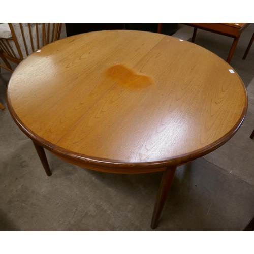 60 - A G-Plan Fresco teak circular extending dining table