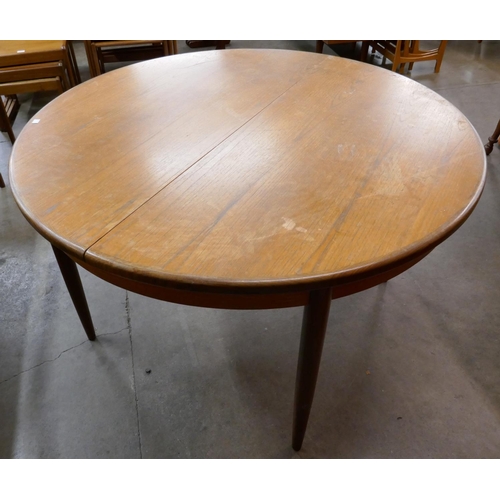 7 - A G-Plan Fresco teak circular extending dining table