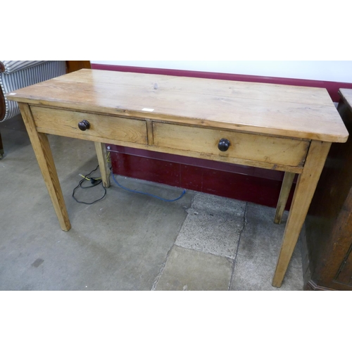 74 - A Victorian pine two drawer kitchen serving table