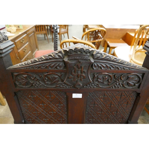 75 - A Victorian Jacobean Revival carved oak Bishops chair