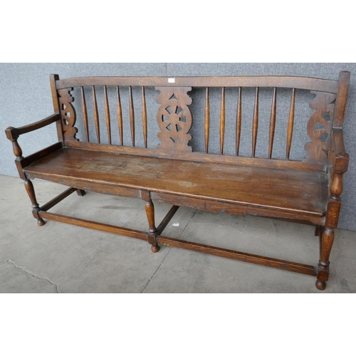 92 - An early 20th Century oak and elm bench