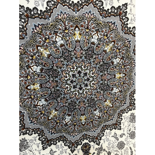 1558 - An ivory ground fine woven iranian runner, embossed floral medallion design, 300cm x 80cm