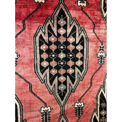 1563 - A washed red ground, full pile persian Hamadan Village rug, 195cm x 130cm