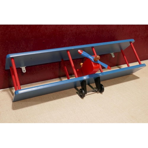 3157A - A red and blue bi-plane wall shelf