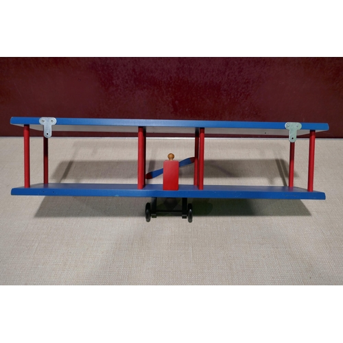 3157A - A red and blue bi-plane wall shelf