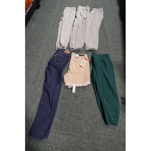 3205 - A quantity of lady's joggers and jeans - various sizes, styles and colours * This lot is subject to ... 