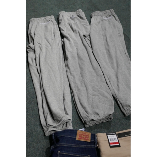 3205 - A quantity of lady's joggers and jeans - various sizes, styles and colours * This lot is subject to ... 