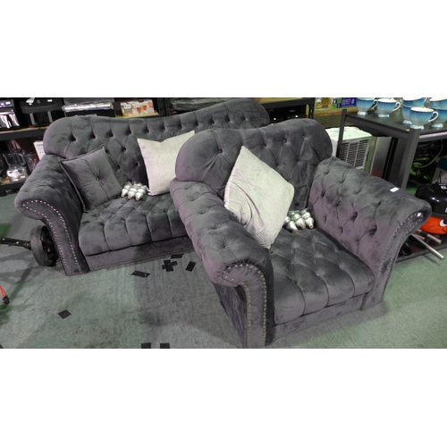 3405 - A two-piece grey velvet studded sofa and armchair with feet