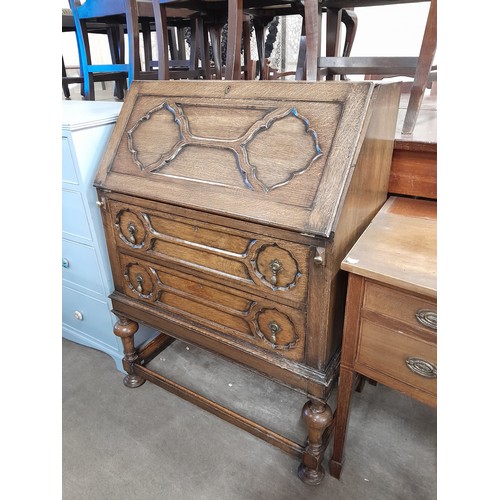 189 - An early 20th Century oak geometric moulded bureau