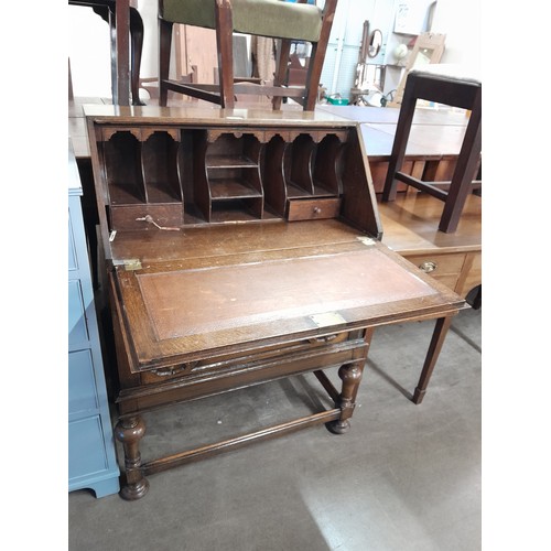 189 - An early 20th Century oak geometric moulded bureau