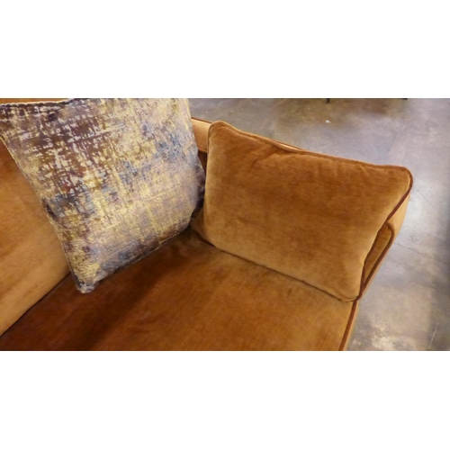 1301 - A turmeric velvet three seater sofa