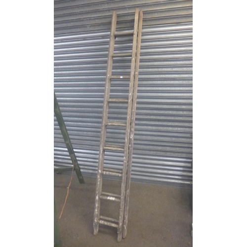 2206 - A set of 10-rung wooden stepladders and a set of 9-rung wooden extension ladders