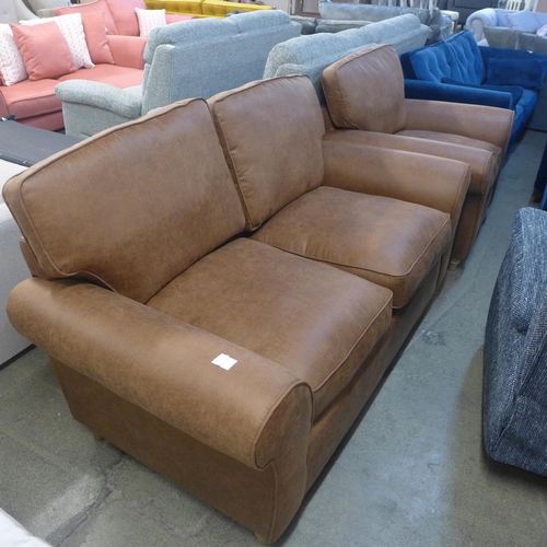1397 - A tan vegan leather upholstered two seater sofa and armchair