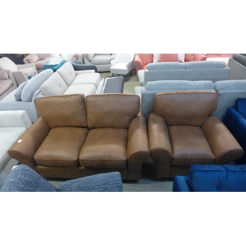 1397 - A tan vegan leather upholstered two seater sofa and armchair