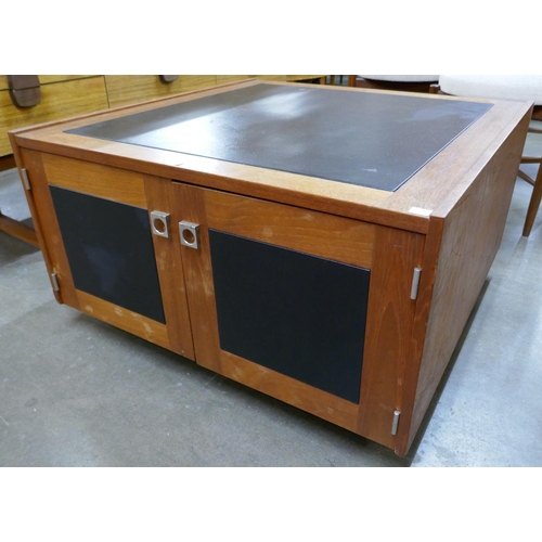 56 - A teak and black vinyl Pandora's box coffee table
