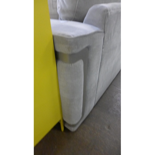 1428 - A grey velvet love seat with steel trim, RRP £2399