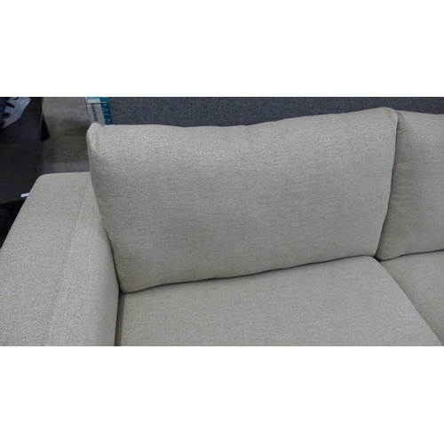 1432 - A sandstone weave four seater sofa