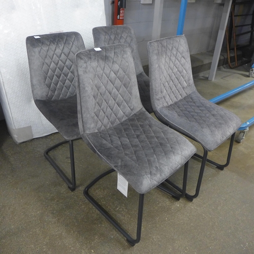 1497 - A set of four grey velvet dining chairs * This lot is subject to VAT