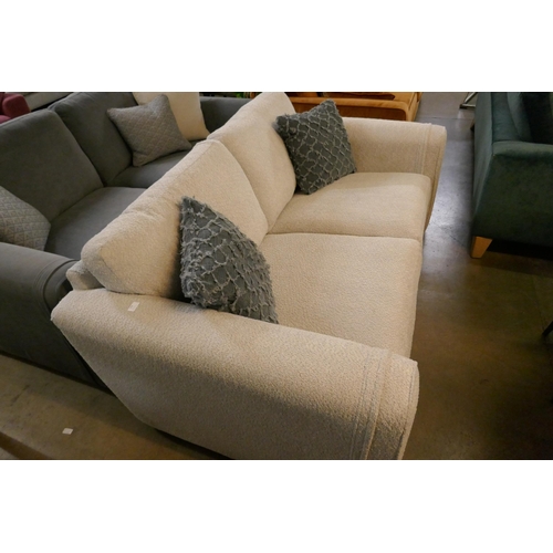 1349 - An ivory upholstered three seater sofa RRP £1099