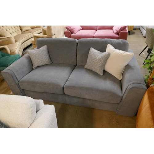 1350 - A steel blue three seater sofa