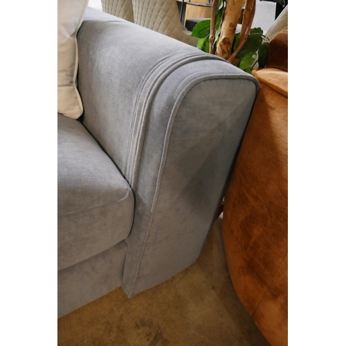 1350 - A steel blue three seater sofa