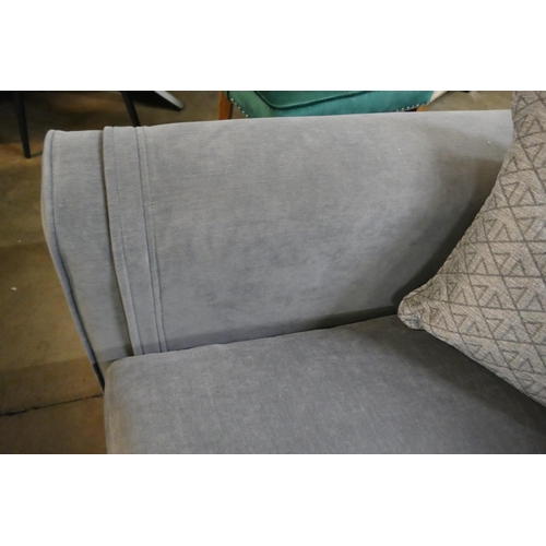 1350 - A steel blue three seater sofa