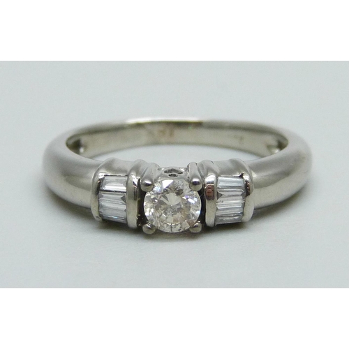 1003 - An 18ct white gold and diamond ring, 4.2g, M, centre stone approximately 0.25ct weight