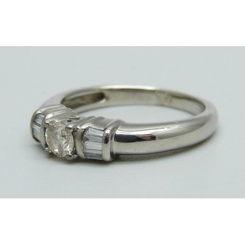 1003 - An 18ct white gold and diamond ring, 4.2g, M, centre stone approximately 0.25ct weight