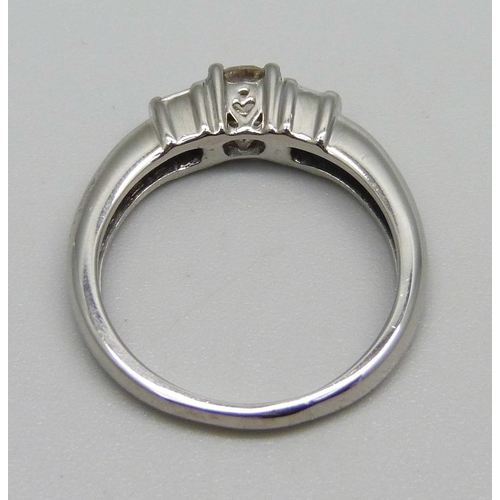 1003 - An 18ct white gold and diamond ring, 4.2g, M, centre stone approximately 0.25ct weight