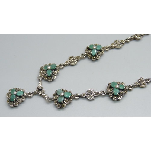 1009 - A silver necklace set with green stones and marcasite (some marcasite missing), 48g