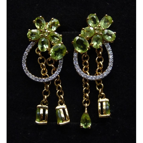 1015 - A pair of silver gilt, peridot and natural zircon drop earrings