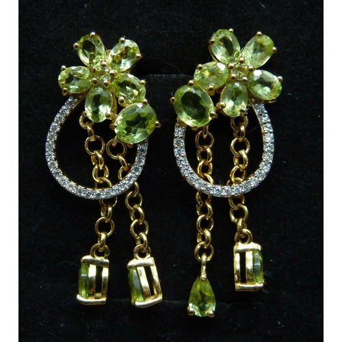 1015 - A pair of silver gilt, peridot and natural zircon drop earrings