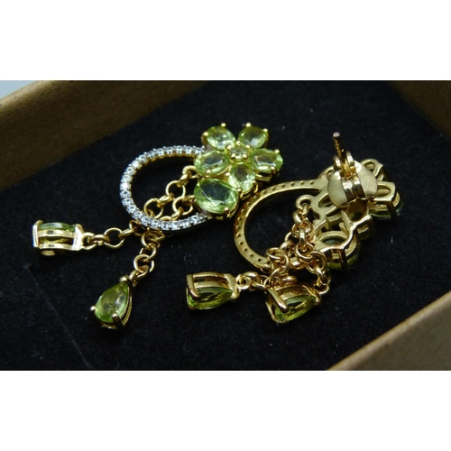 1015 - A pair of silver gilt, peridot and natural zircon drop earrings