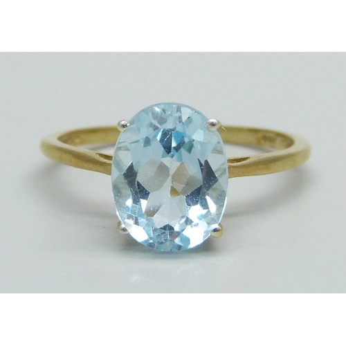 1030 - A silver gilt and blue stone solitaire ring, Q